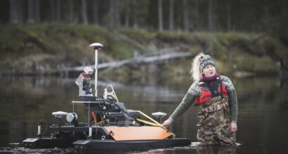 Researcher Linnea Blåfield with the Otter USV, photo Ville Kankare